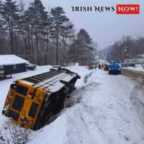 School bus in a ditch on a snowy road after a winter crash in Middlesex.