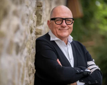 Hugh Wallace smiling during a Home of the Year episode, showcasing a modern Irish home.