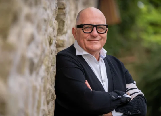 Hugh Wallace smiling during a Home of the Year episode, showcasing a modern Irish home.
